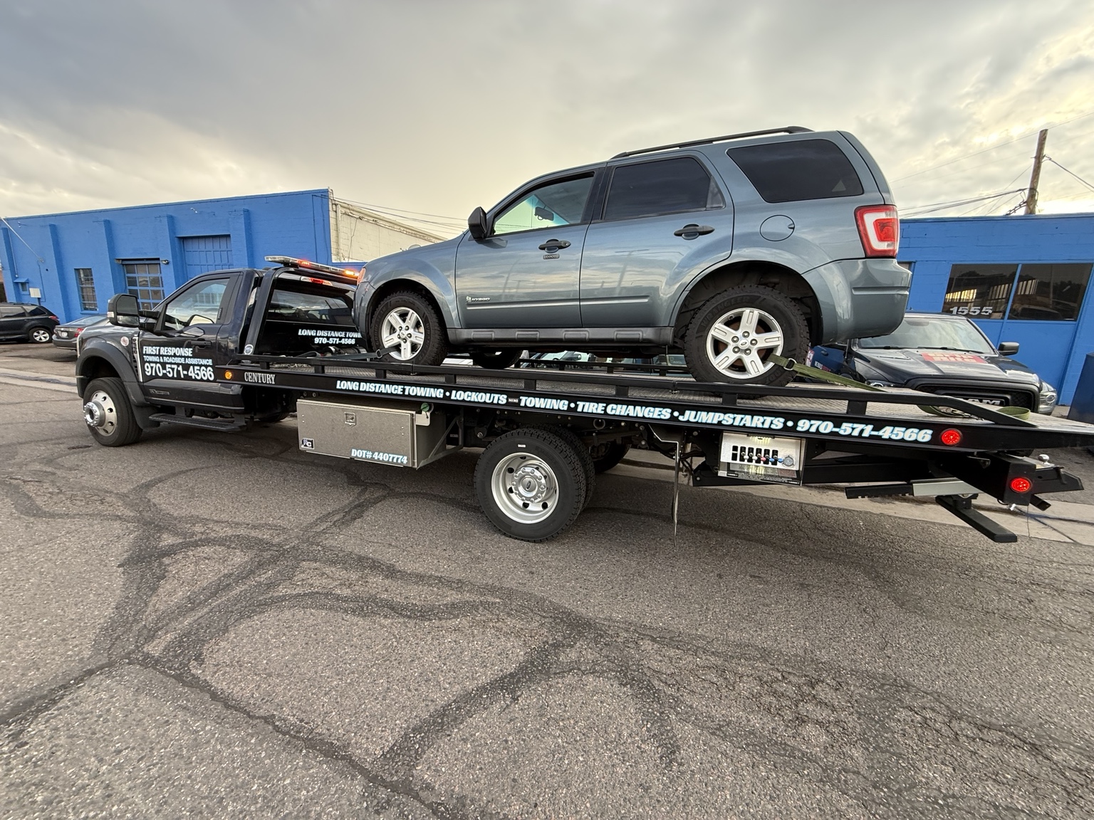 Hybrid vehicle on a First Response Towing flatbed