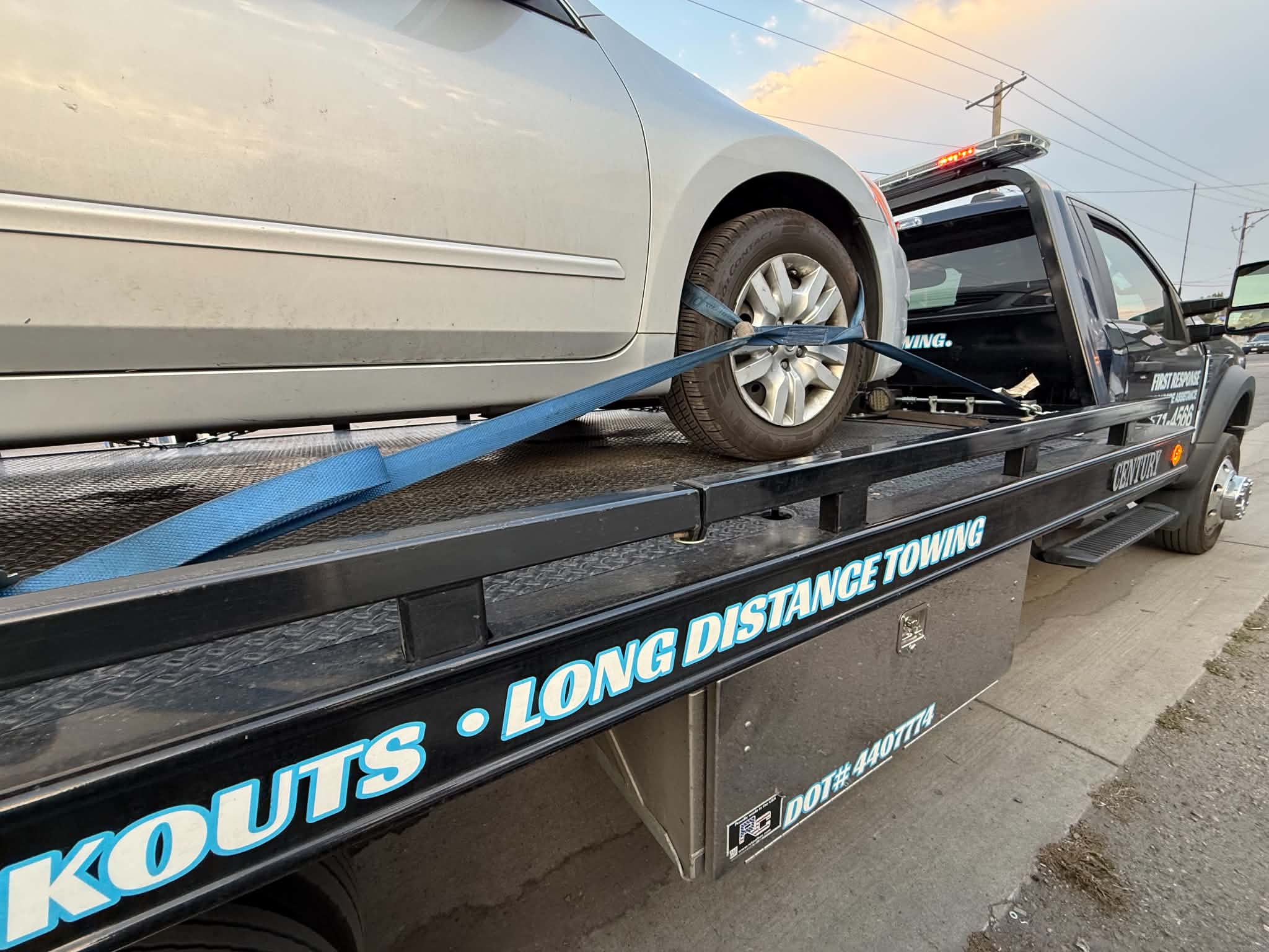 SUV secured on a tow trailer for the Daily Towing Jobs gallery
