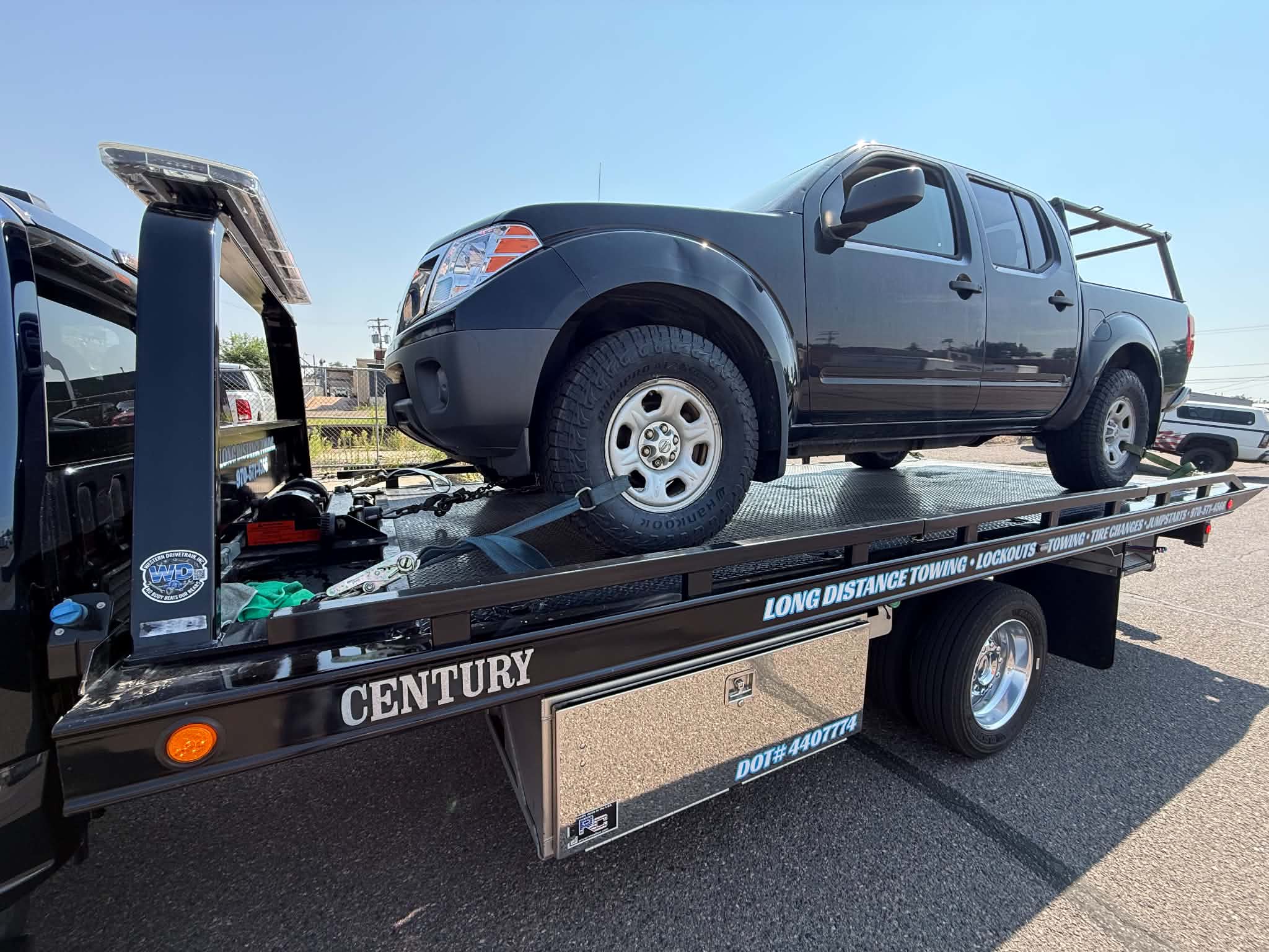 Dark pickup truck loaded on a First Response Towing flatbed for the Daily Towing Jobs gallery