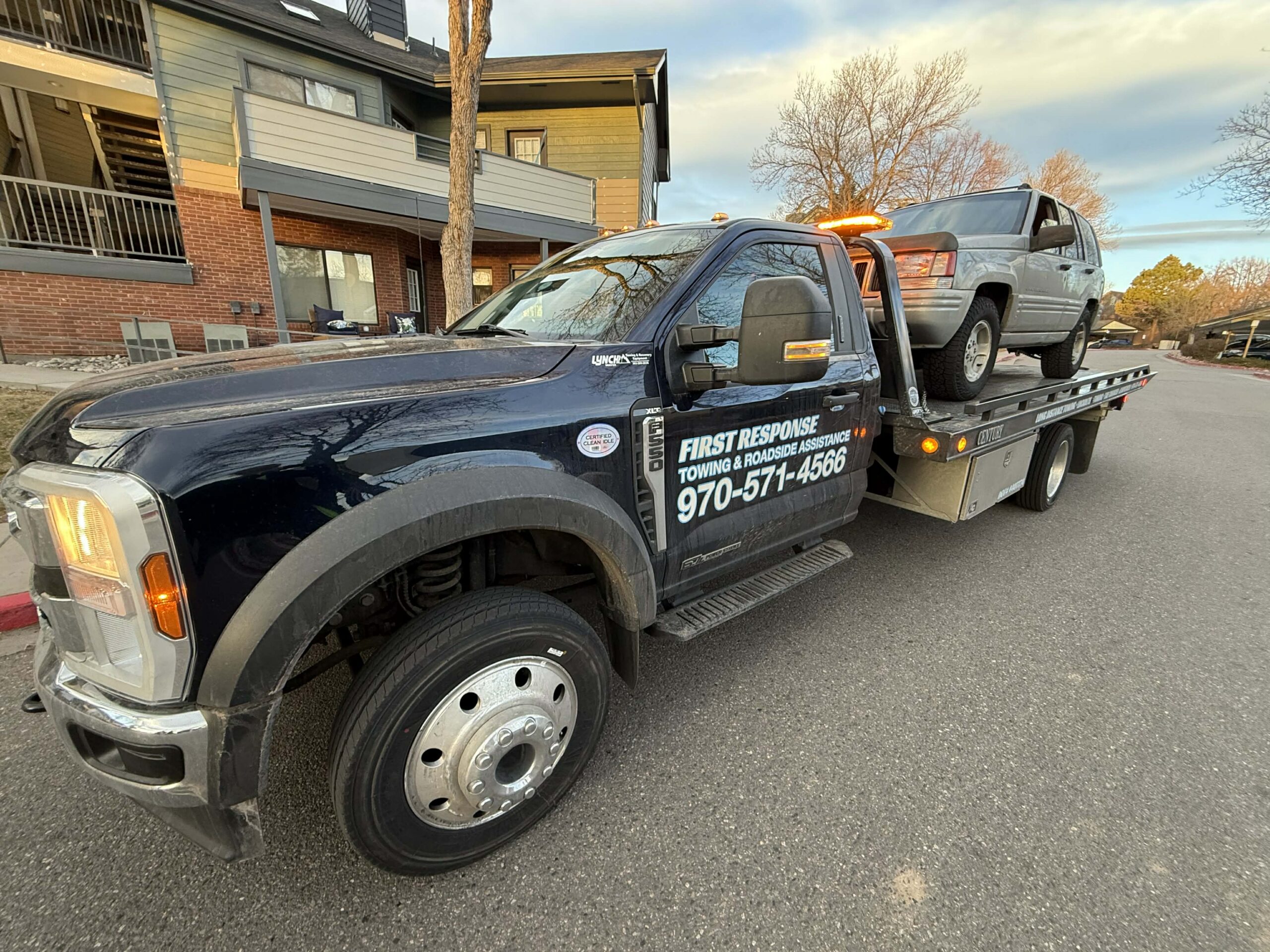 First Response Towing truck in action on a residential street