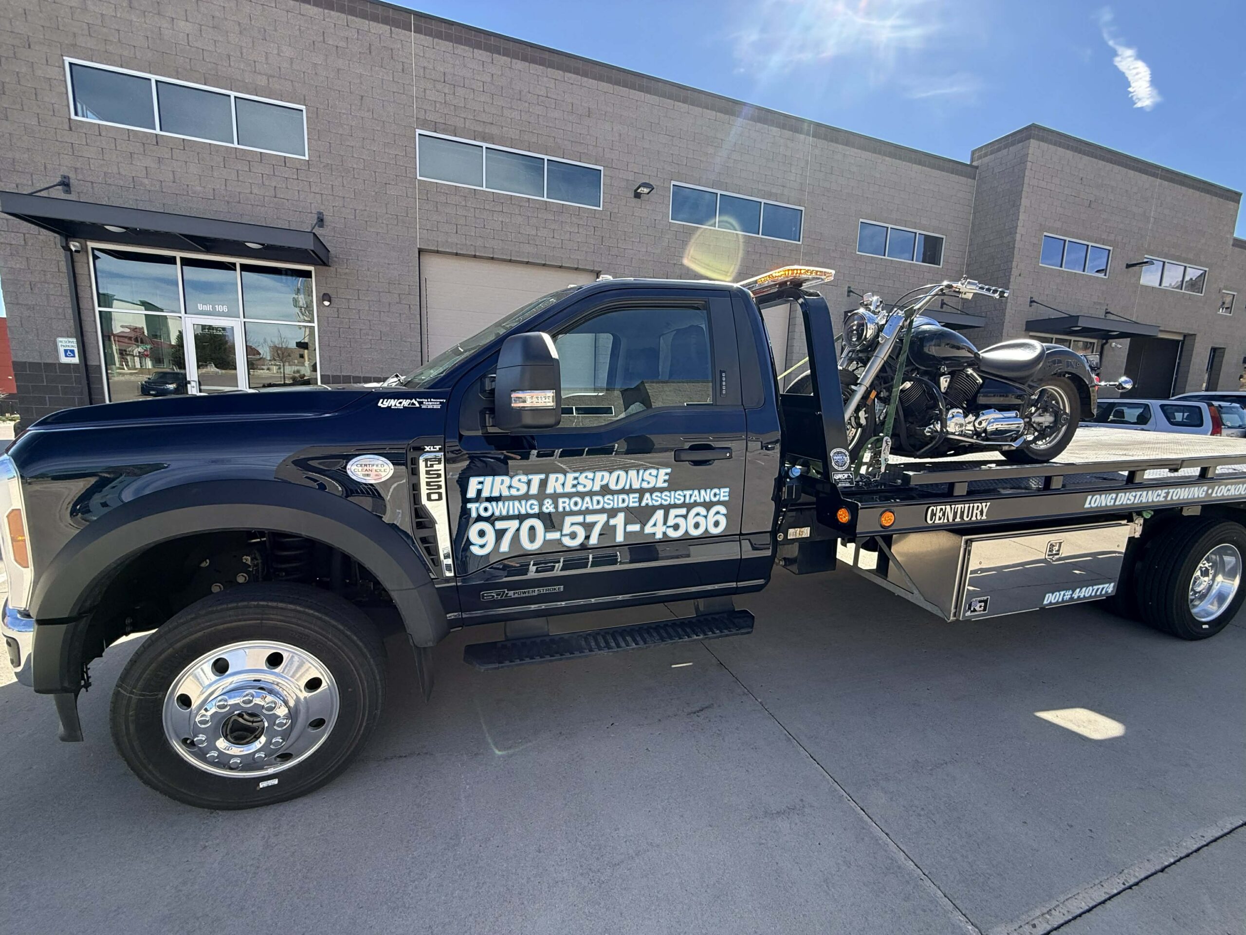 First Response Towing flatbed carrying a motorcycle